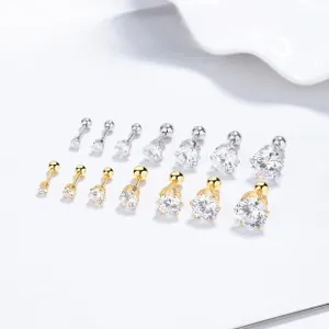 Macro detail of 925 silver screw back zircon earrings in various sizes and gold silver tones