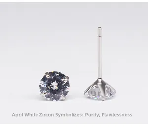 Macro shot of 925 sterling silver four-prong white zircon earrings for April birthstone