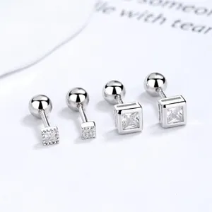 Close-up of square 925 sterling silver screw back earrings with sparkling zircon stones