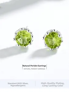 Macro view of S925 sterling silver stud earrings with round natural peridot gemstones