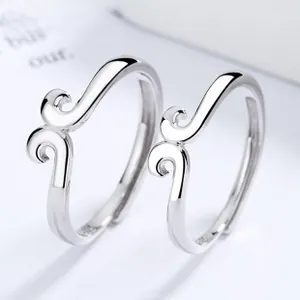 Macro shot of 925 sterling silver couple rings showing the internal S925 hallmark