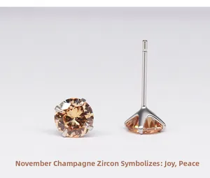 Detail of champagne cubic zirconia stud earrings in a four-claw silver setting