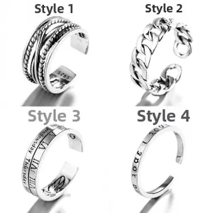 Detail view of four S925 sterling silver open rings with unique engraved patterns and textures