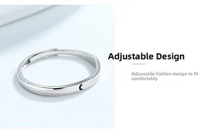 Detail view of silver adjustable crescent moon ring with minimalist engraved symbol