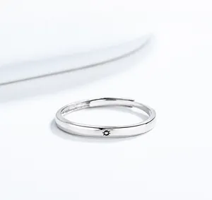 Detailed macro view of the 925 silver sun pattern engraving on an adjustable ring band