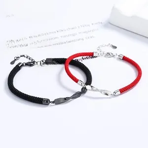 Detail of red and black woven infinity bracelets with S925 silver adjustable chains