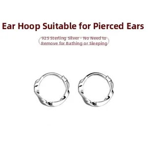 Macro view of 925 sterling silver hoop earrings with twisted rope texture design