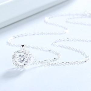 Sparkling S925 sterling silver necklace featuring a round dancing crystal pendant charm