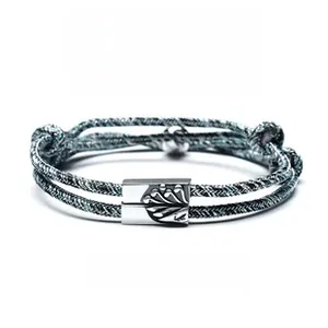 Detail of S925 silver magnetic couple bracelets with mountain and sea relief charms
