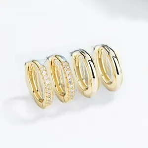 Close-up of gold-plated silver hoop earrings featuring polished finish and zircon inlay