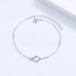 Macro detail of a S925 sterling silver bracelet with a teardrop moonstone charm