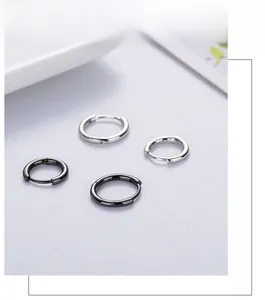 Detail view of four S925 sterling silver hoop earrings in silver and gun-black finish