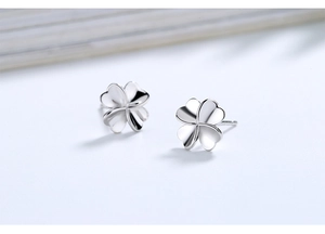 Close-up of polished S925 sterling silver four-leaf clover stud earrings for women