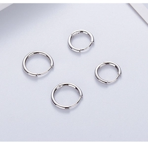 Detailed view of four minimalist high-polish s925 silver sleeper hoop earrings set