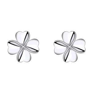 Detailed macro view of S925 sterling silver four-leaf clover stud earrings on white background