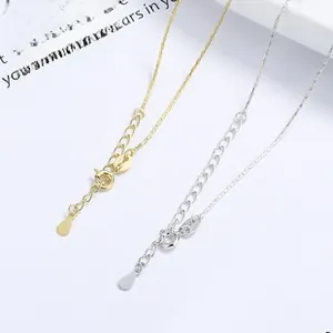 Detail of gold and silver snake chain necklaces with lobster clasp and teardrop charm