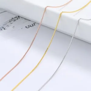 Detailed close-up of three 925 silver box chains in rose gold, gold, and silver finishes