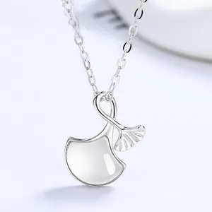 Macro detail of 925 silver ginkgo leaf pendant with white mother of pearl inlay