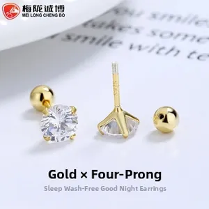 Macro shot of 925 silver gold-plated screw back stud earrings with four-prong cubic zirconia