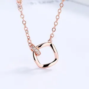 Macro shot of rose gold 925 silver necklace featuring a twisted square pendant with tiny diamonds