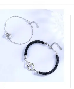 Close-up of S925 sterling silver interlocking rings with Keep Me In Your Heart engraving