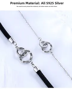 Macro detail of S925 silver interlocking rings engraved with Keep Me In Your Heart