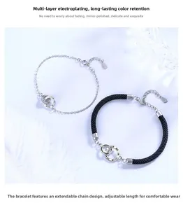 Interlocking double ring couple bracelets with Keep Me In Your Heart engraving detail