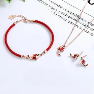 Detail of 925 sterling silver koi fish jewelry set with rose gold and red enamel