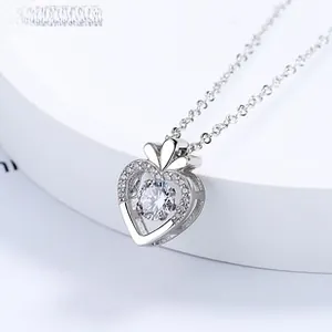 Detail of 925 sterling silver heart necklace with a sparkling dancing stone center