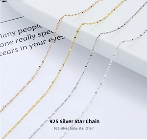 Detail of four S925 sterling silver star chains in rose gold, gold, white gold, and silver