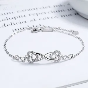 Close-up of S925 sterling silver infinity heart bracelet with cubic zirconia details