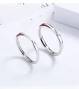 Macro shot of S925 sterling silver earrings with hallmark stamp on art card background