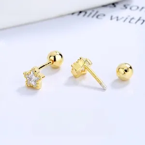 Macro view of gold pentagram stud earring with zirconia stone and screw-back closure