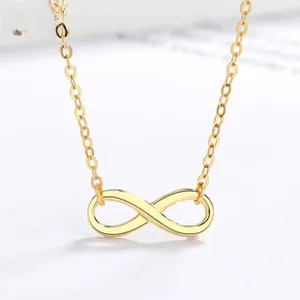 Macro shot of 925 sterling silver infinity pendant with gold plating and thin chain