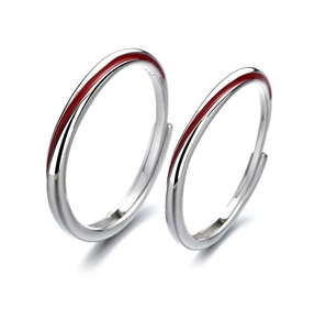 Detailed macro view of S925 sterling silver Mobius rings with red enamel line accents
