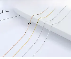 Macro shot of s925 sterling silver necklaces in gold and rose gold tones for women