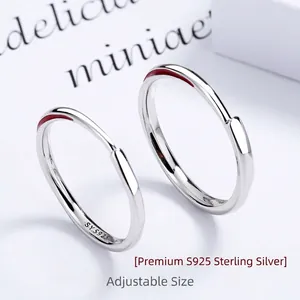 S925 sterling silver Mobius rings with red enamel detail on a minimalist open band