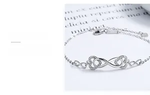 Close-up of S925 sterling silver infinity heart bracelet with white zircon inlay detail