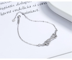 Detailed macro view of S925 sterling silver lobster clasp and infinity heart charm link