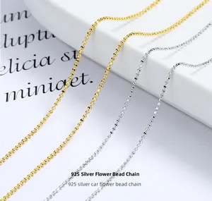 Detailed view of 925 sterling silver diamond-cut bead chain in gold and silver finish