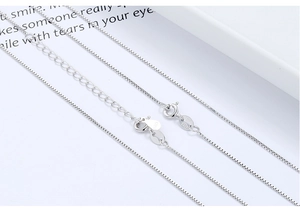 Macro detail of S925 sterling silver box chain with Italy hallmark and spring clasp