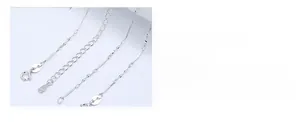 Macro detail of S925 sterling silver chain with lobster clasp and adjustable ball slide