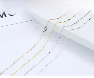 Close-up of S925 sterling silver twisted chain necklaces in gold and rose gold finishes