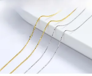 Close-up of elegant s925 silver beaded ball chains in gold and silver finishes