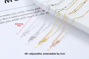 Macro detail of S925 sterling silver adjustable necklace chain extension with logo tag