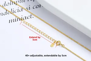 Macro detail of S925 sterling silver gold beaded necklace with lobster clasp and extension chain