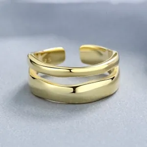 Detail shot of the S925 hallmark on an irregular textured gold double-layer open ring
