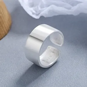 Macro detail of polished 925 sterling silver wide ring with S925 hallmark on the inner band