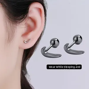 Close-up of gunmetal swoosh thread earrings shown on ear for sleep-safe wear