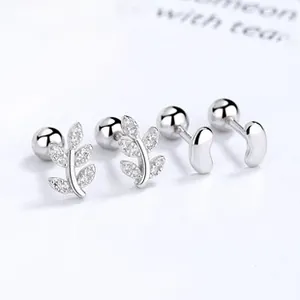 Macro shot of 925 silver leaf stud earrings with zircon and screw back closure